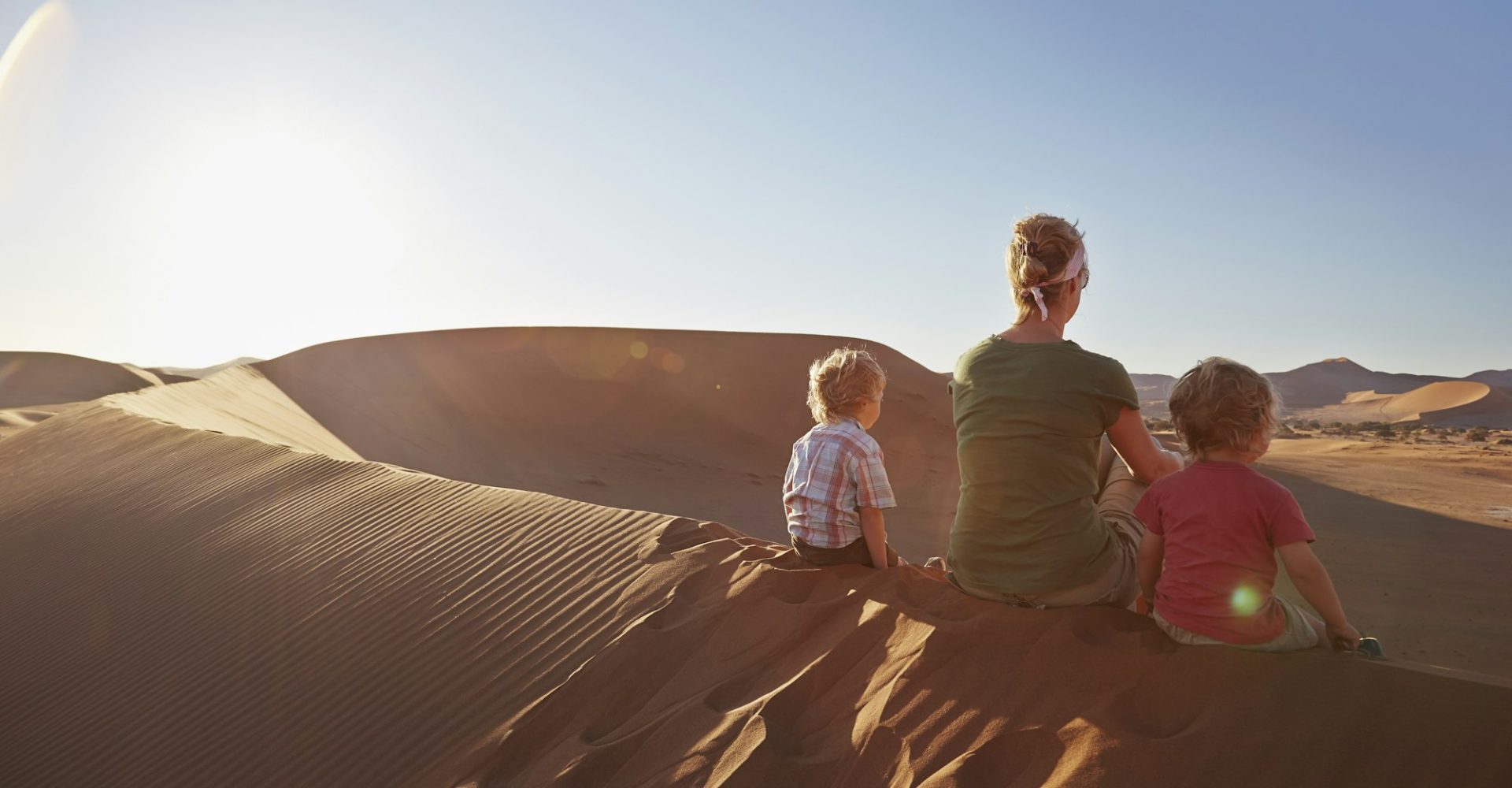 mother-and-sons-sitting-on-sand-dune-namib-naukluft-national-park-namib-desert-sossusvlei-dead.jpg