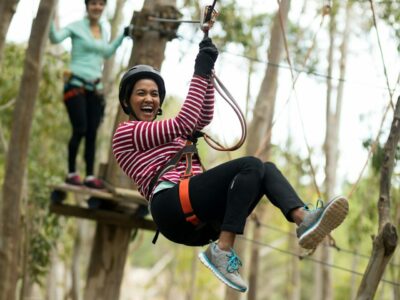 Woman on zipline in adventure park