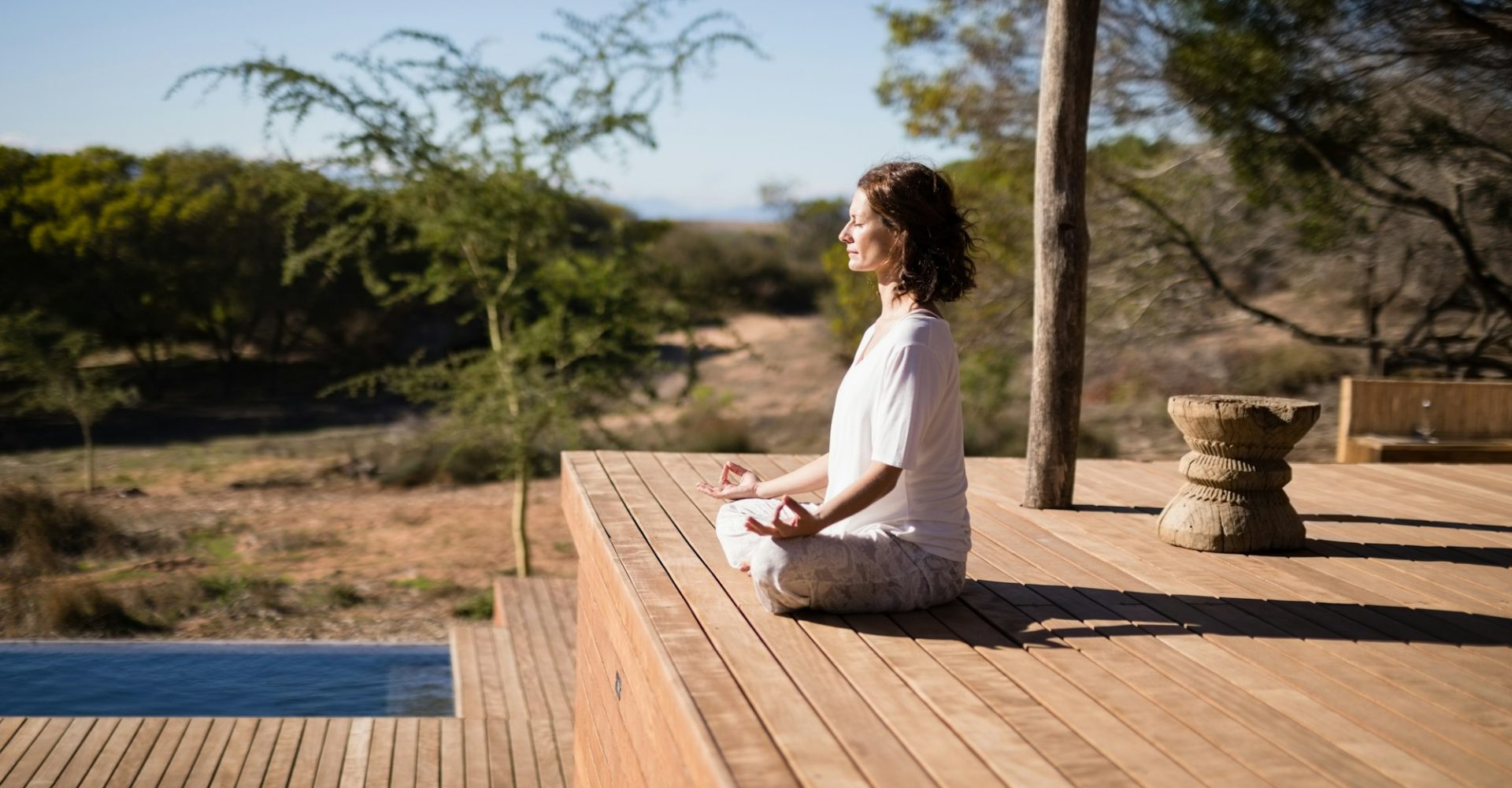 woman-practicing-yoga-on-wooden-plank.jpg